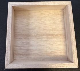She grabbed this little shadow box from Michaels for a cute and easy storage hack