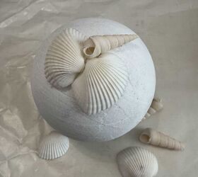 Stick a bunch of seashells to a styrofoam ball for a coastal idea you'll want to keep all year round
