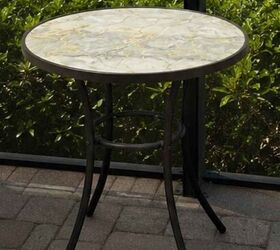 She took the top off this patio table to give it a stunning coastal upgrade