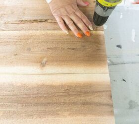 She drills a hole through a wooden plank for this impressive outdoor idea that's built to last