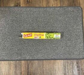 Solve an annoying problem by putting cling wrap under your mats