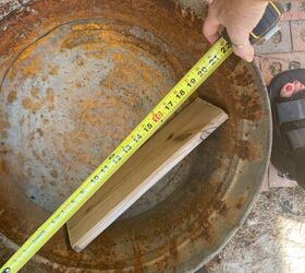 She measures a wooden board in this rusty old tub for the most interesting reason