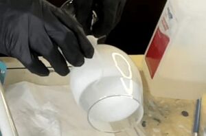 She rubs alcohol on wine glasses for a really cool decor trick