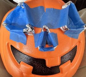She sticks tape on a plastic pumpkin for one of the coolest ideas you'll see this fall