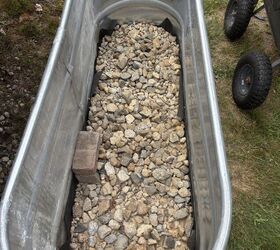 She pours a bunch of paving stones into this stock tank for this jaw-dropping garden idea
