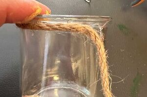 Wrap jute rope around an empty glass jar for easy and fun decor
