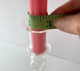 She measures a candle for this crazy-cheap Anthropology dupe