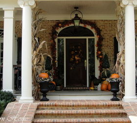 southern fall porch, porches, seasonal holiday decor, corn stalks from the local produce stand flank the entrance to the porch tied with burlap ribbon