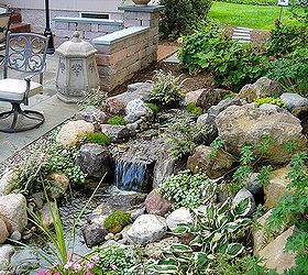 stone amp brick patio repair led lighting waterfalls fountain and landscaping in, fire pit, patio, ponds water features, Brighton NY Disappearing Pondless Waterfall Water feature Fountain in Brighton NY by Acorn Landscaping of Rochester NY The Patio is pitched so the rain water goes right to this Low Maintenance Water Feature Brighton NY