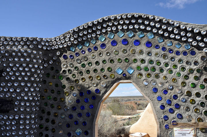 cool and crazy uses for empty beer bottles, repurposing upcycling, Bottles and mud are the materials used in this wall at an Earthship community in New Mexico Photo KMS Woodworks Networx com