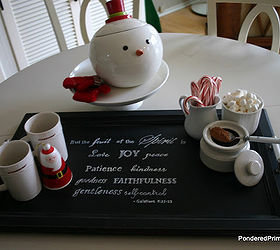 cabinet door tray and hot chocolate station, christmas decorations, doors, kitchen cabinets, repurposing upcycling, seasonal holiday decor, To create this tray we painted the cabinet door black distressed with sandpaper added an inspiration quote with a white paint and put handles on both ends It was finished off with a coat of polyurethane for protection