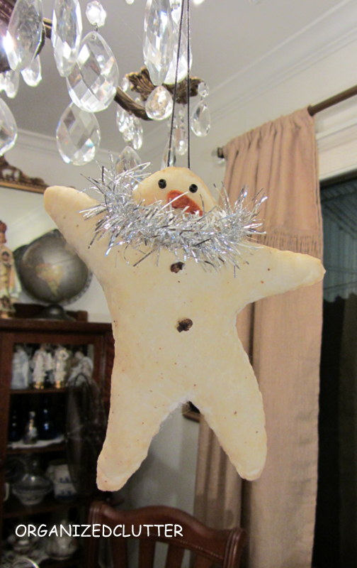 blog inspired star snowman, crafts, decoupage, seasonal holiday decor, After the snowman was dry I glued black seed button for eyes a felt nose and whole cloves for the buttons I rubbed a cotton swab with a little blush on his cheeks and glued on a piece of tinsel garland