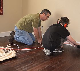 living room remodel base molding young hands and old walls, flooring, home improvement, living room ideas, wall decor, woodworking projects, Jack helping with some nail gunnery