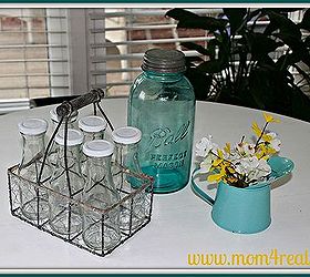 cottage breakfast nook, home decor, kitchen design, shelving ideas, For a centerpiece I added a few items I had around my kitchen The old Ball jar was a gift from my mother and I scored the glass bottles and wire basket from Decor Steals