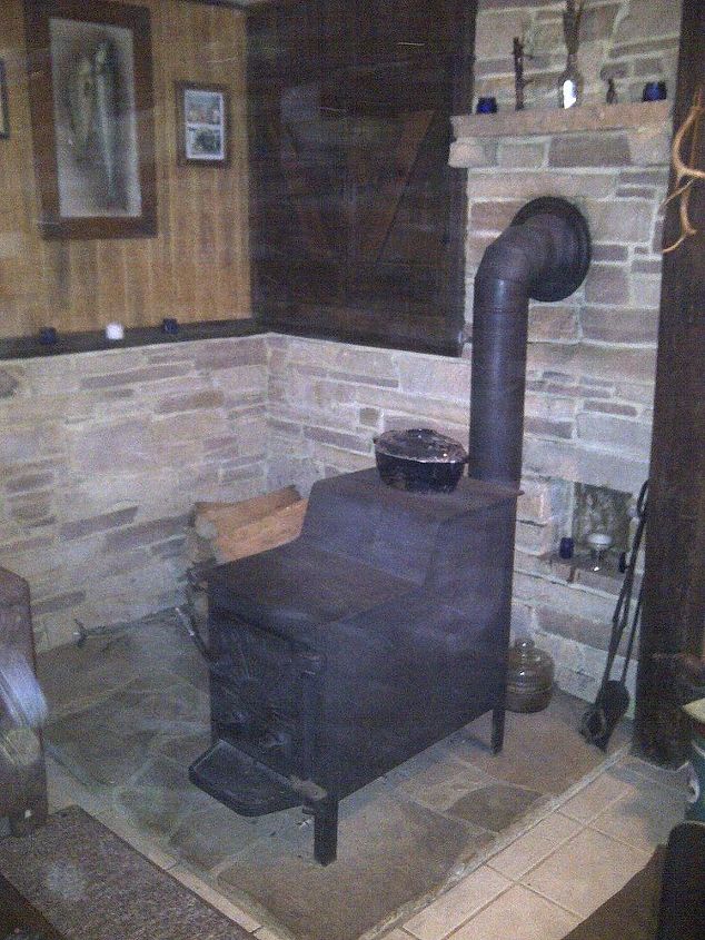 basement remodeling, basement ideas, diy, home improvement, I built a stone hearth large enough to stack firewood beside the wood stove