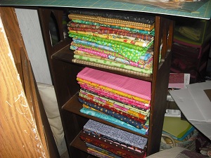 quilting info here is something that will save u room with your fabric, craft rooms, organizing, Look here this is an antique SMALL bookcase ok look at all the material that is wrapped and in this small space I have 1 yd and 3 yrds on them wrapped U can go up to 8 or 9 yrds Fleece and flannel not as much for sure