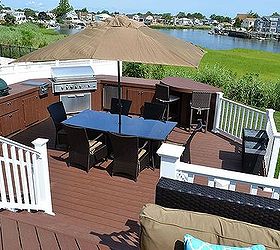 the deck and patio company replaces pool deck after hurricane sandy, curb appeal, decks, outdoor living, patio, Custom Outdoor Kitchen A new grill refrigerator and smoker cooker are set within curved custom cabinetry with raised bar that mimics the Trex decking