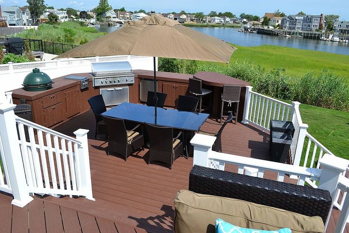 the deck and patio company replaces pool deck after hurricane sandy, curb appeal, decks, outdoor living, patio, Custom Outdoor Kitchen A new grill refrigerator and smoker cooker are set within curved custom cabinetry with raised bar that mimics the Trex decking
