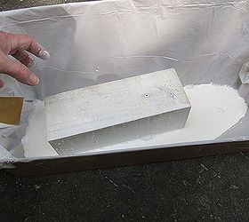 quick amp easy halloween decor, crafts, halloween decorations, seasonal holiday decor, I made a trough out of a cardboard box and a garbage bag to paint the posts instead of using a paint brush It gives them a great white wash look