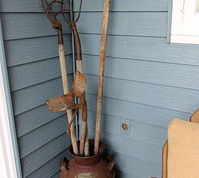 decorating the front patio with vintage collectibles, gardening, outdoor living, repurposing upcycling, Farm tools in a milk can