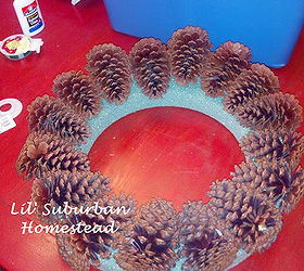 too many pine cones in your yard make a diy pinecone wreath, crafts, seasonal holiday decor, wreaths, Before I go forward with this project I lay all the pinecones around the foam wreath and then I hot glue them on but I later found out I had to wire tie them on with the floral wire as well