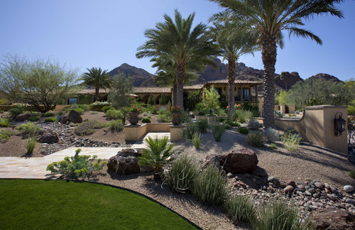 front yard landscaping, landscape, Cut down on the amount of sod in your front yard by adding gravel areas with desert plants