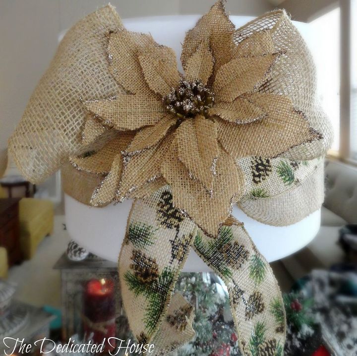 holiday design challenge with hometalk and lamps plus, lighting, seasonal holiday decor, To decorate the shade I used a burlap ribbon tied in a bow with a pinecone ribbon layered on top Next I placed a burlap poinsettia and secured it in the knot of the bow