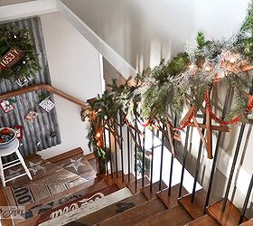 expect the unexpected with this junker s christmas home tour, seasonal holiday d cor, wreaths, The stair rail is filled with kindling stars