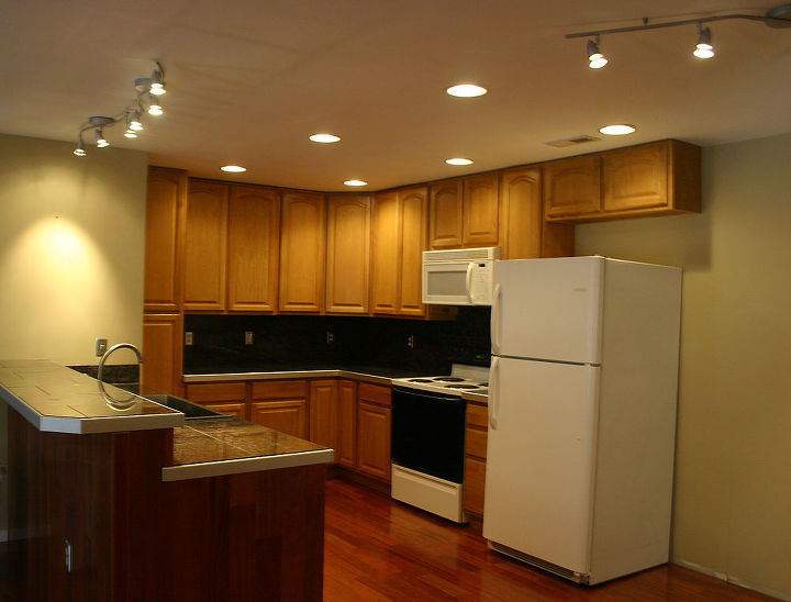 apartment kitchen open concept, home decor, kitchen design, 42 Oak all wood upper cabinets and lower cabinets Pot lights and tacks leave no place for shadows