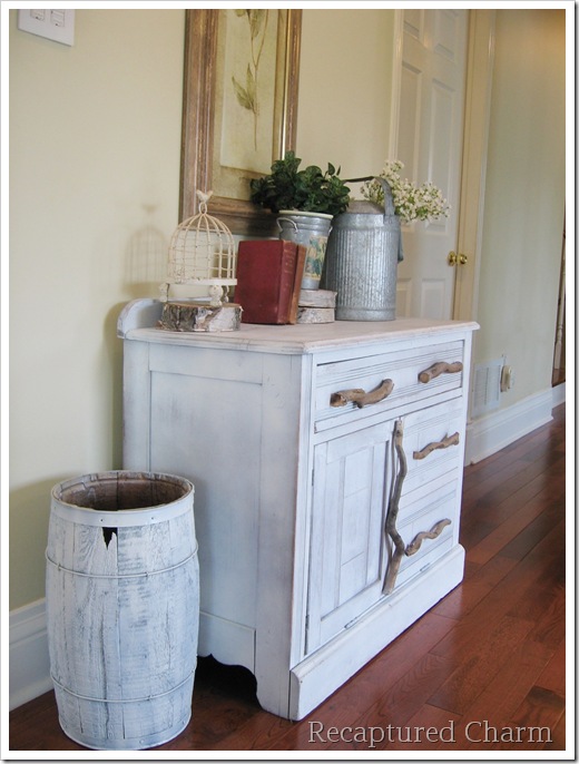 you ll never guess what s inside this cabinet, painted furniture, repurposing upcycling, rustic furniture, We used old branches from the yard as hardware in keeping with the rustic look