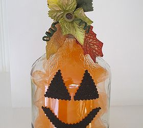 pumpkin re purpose project bottle into a pumpkin candle holder, crafts, halloween decorations, repurposing upcycling, seasonal holiday decor, Completed transformation from bottle to pumpkin