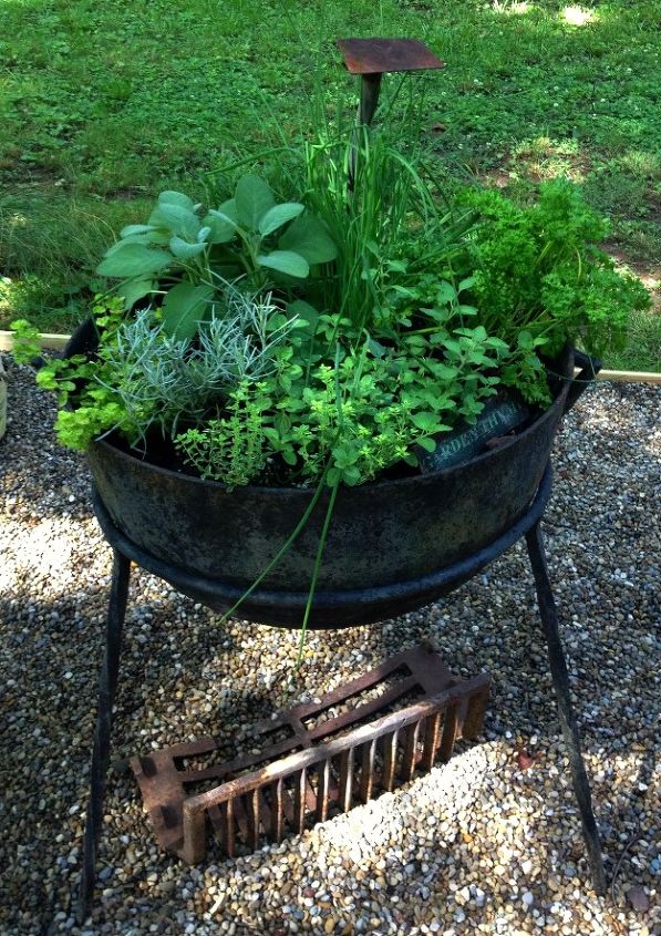adding vintage junk to the garden, container gardening, flowers, gardening, repurposing upcycling, Old cauldron full of herbs for potion making or cooking I m always thinking of Halloween