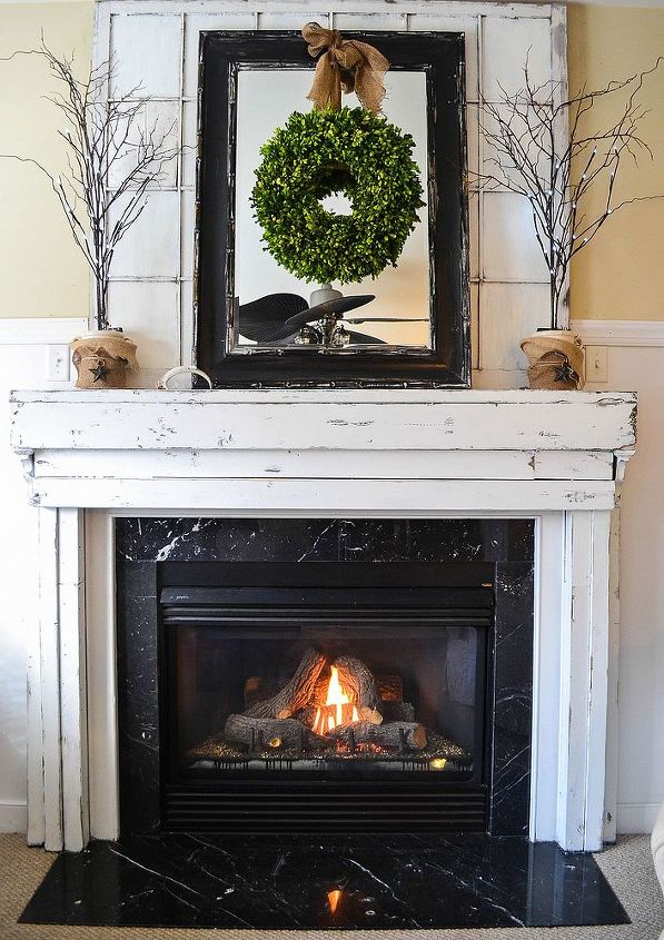 moving the tv off the mantel much better, fireplaces mantels, home decor, living room ideas, I covered the big TV hole with an old window I primed the glass with Bin so it wasn t see through It s braced to the wall with small corner brackets