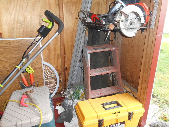 it s time for fall cleaning i started out in my old shed, cleaning tips, The bottom rack holds my power tools The corner was just right for roofing rolls siding strips my moms tiny step ladder