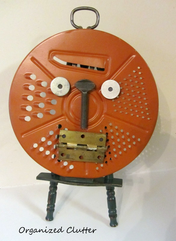 a junk pumpkin with changeable faces for kids, crafts, halloween decorations, repurposing upcycling, seasonal holiday decor, My pumpkin face is a grater but any round baking pan would work too as long as your magnets will stick