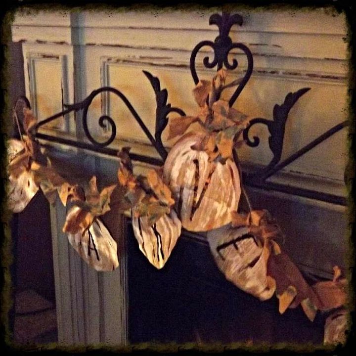 a pumpkin spice brown paper bag garland, crafts, seasonal holiday decor, Each pumpkin has a stem leave and bow