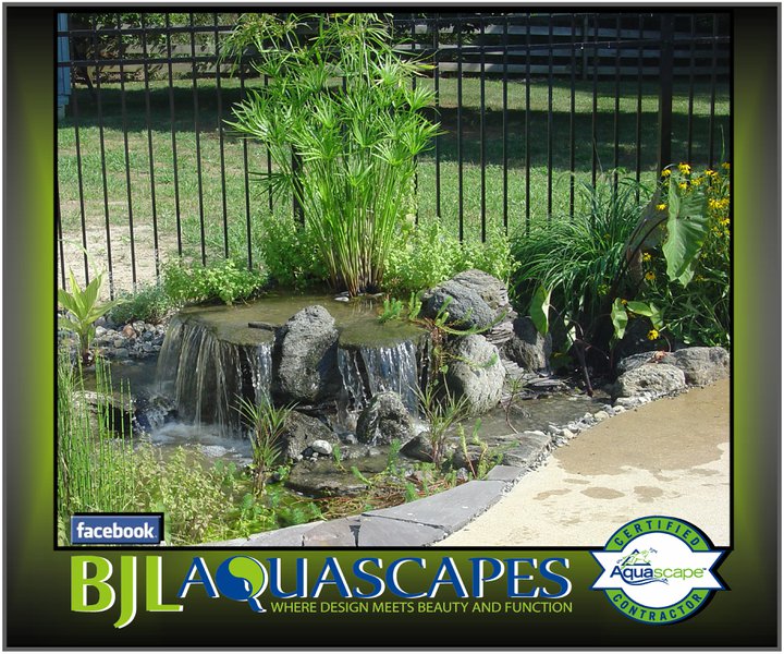 pondless waterfalls disappearing waterfalls waterfall ideas in new jersey bjl, landscape, outdoor living, ponds water features, Small pondless waterfalls can be added just about anywhere in your landscapes This water feature is squeezed in between a patio and fence for a great effect night or day