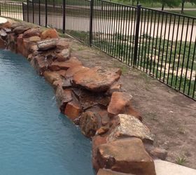 how do we landscape around our pool, landscape, pool designs, This is the backside of the pool We would like to use small rock for covering No idea what to plant Remember this can be viewed by folks driving by