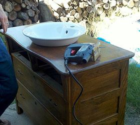 my hubby working on our main floor bathroom vanity we purchased the antique dresser, bathroom ideas, diy, home decor, It fits