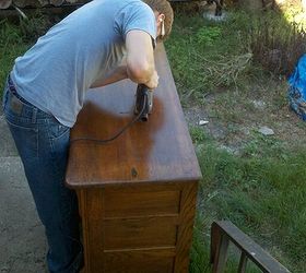 my hubby working on our main floor bathroom vanity we purchased the antique dresser, bathroom ideas, diy, home decor, The first cut into the antique dresser