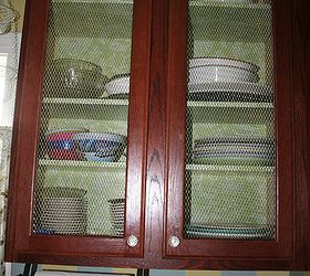 improve cheap cabinets by removing center panel and adding chicken wire or decorative wire. Gives it a custom look