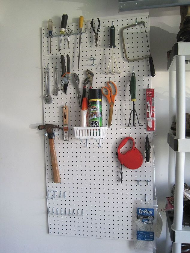 organize your garage for 25 bucks, garages, organizing, Ta da Here is the wall of STUFF versus the staris of stuff So neat and organized and everyone can EASILY find what they need at any time The best garage organization ever