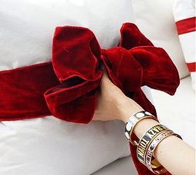 simple valentine s decorating tie a red bow around your sofa pillows, crafts, seasonal holiday decor, valentines day ideas, If you wrap the pillow with a separate piece than you use to make the bow it will keep the band wide instead of getting scrunched up