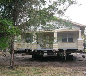 a house move, architecture, The house is loaded onto steel beams and wheels