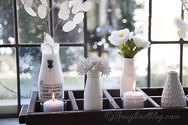 spring decoating on the window sill, home decor, seasonal holiday decor, White vases with fake flowers will last a pretty long time