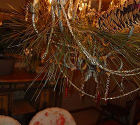 antique christmas decor, christmas decorations, repurposing upcycling, seasonal holiday decor, wreaths, Antique tinsel I strung from my chandelier with some greenery I used more glass ice cycle ornaments on this light as well