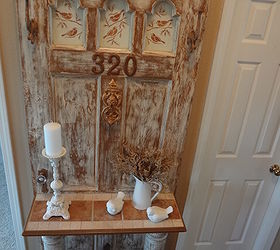 vintage door turned into hall tree for the entrance, home decor, repurposing upcycling, Wanted to highlight the three glass arched windows so decided to stencil birds on pieces of wood and we nailed the pieces behind the windows