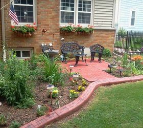 my large landscape project, flowers, gardening, landscape, I installed a patio in the front of the house with patio blocks and then had an extruded concrete border put in with a stamped brick design I added the plants the solar operated bird bath solar garden lights and iron furniture