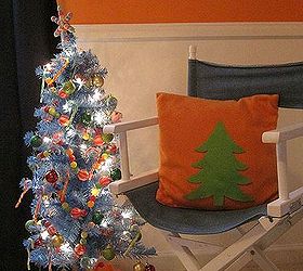 bright amp cheerful kid s christmas decor, christmas decorations, crafts, seasonal holiday decor, The pillow is plain orange fleece To spruce it up for Christmas I cut a tree shape from felt stuck it on the pillow The felt clings to the fleece