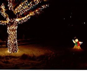 outdoor christmas decorations, seasonal holiday d cor, Oak tree in front yard that I strung the lights up by myself in the night and before a storm Christmas of 2009